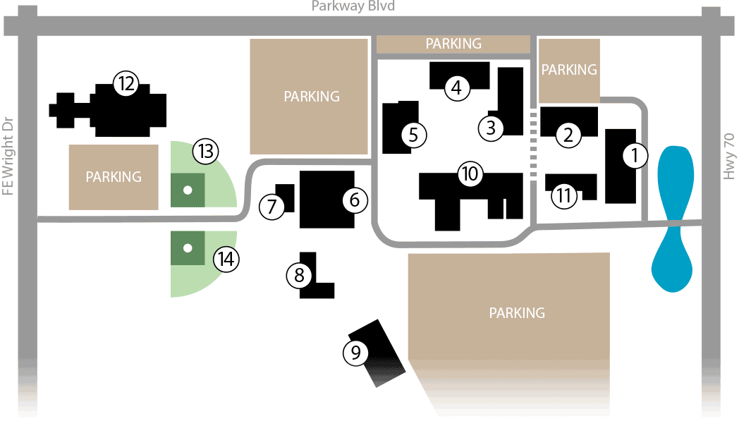 Jackson State Community College campus map showing building locations numbered 1 through 14, parking areas in tan, green spaces, and a blue pond, bordered by Parkway Blvd and FE Wright Dr.