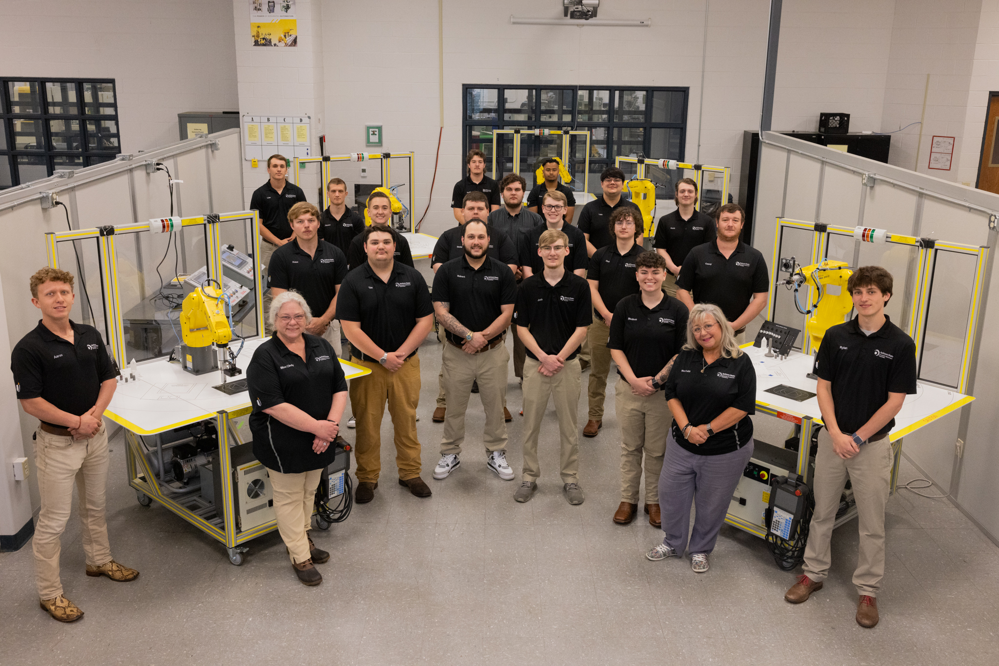 Group of Advanced Maintenance Technician (AMT) students and staff in the McWherter Center