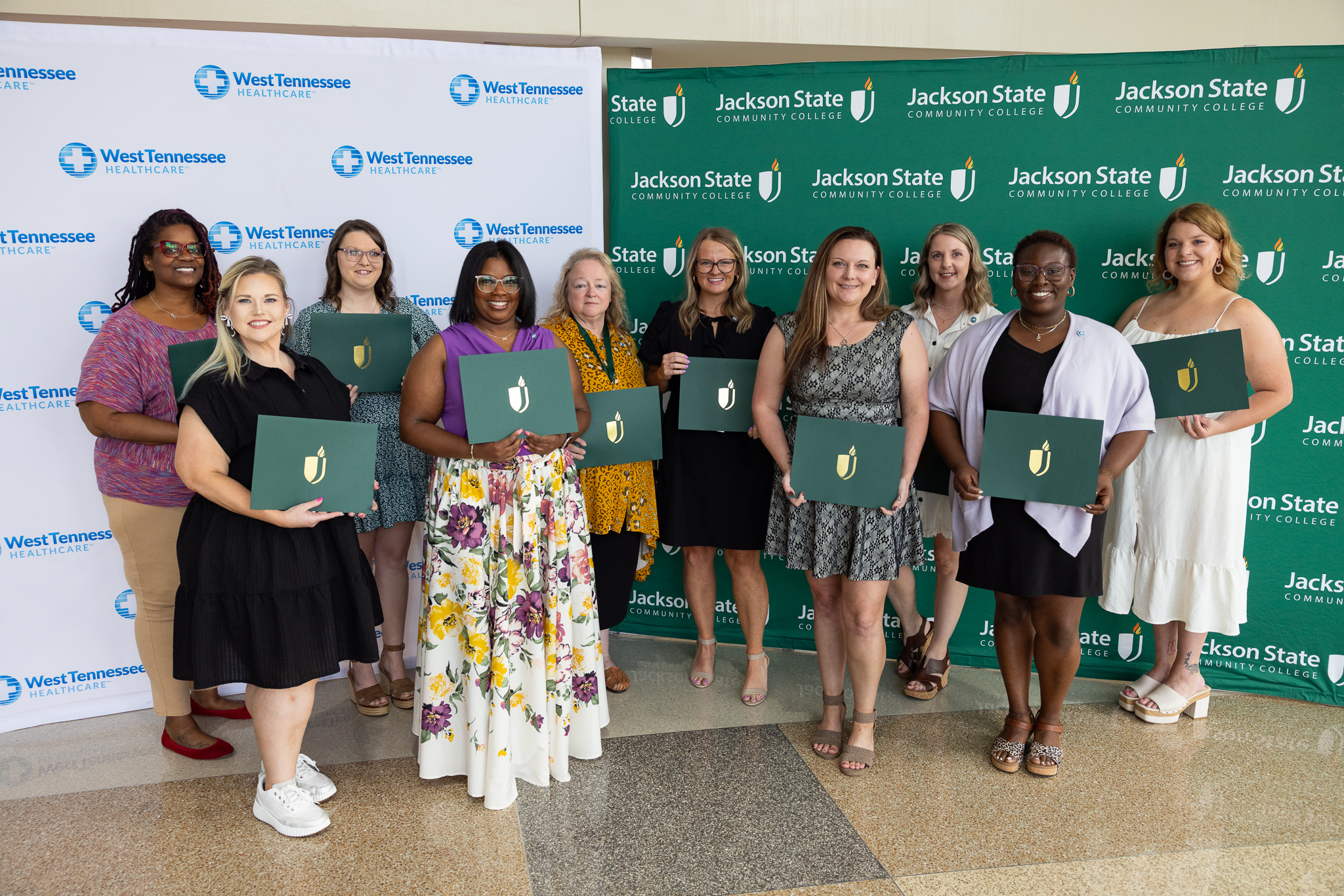 West TN Healthcare Employees holding their certificates of completion after graduating from the CMA program at JSCC as part of a partnership between the two organizations.